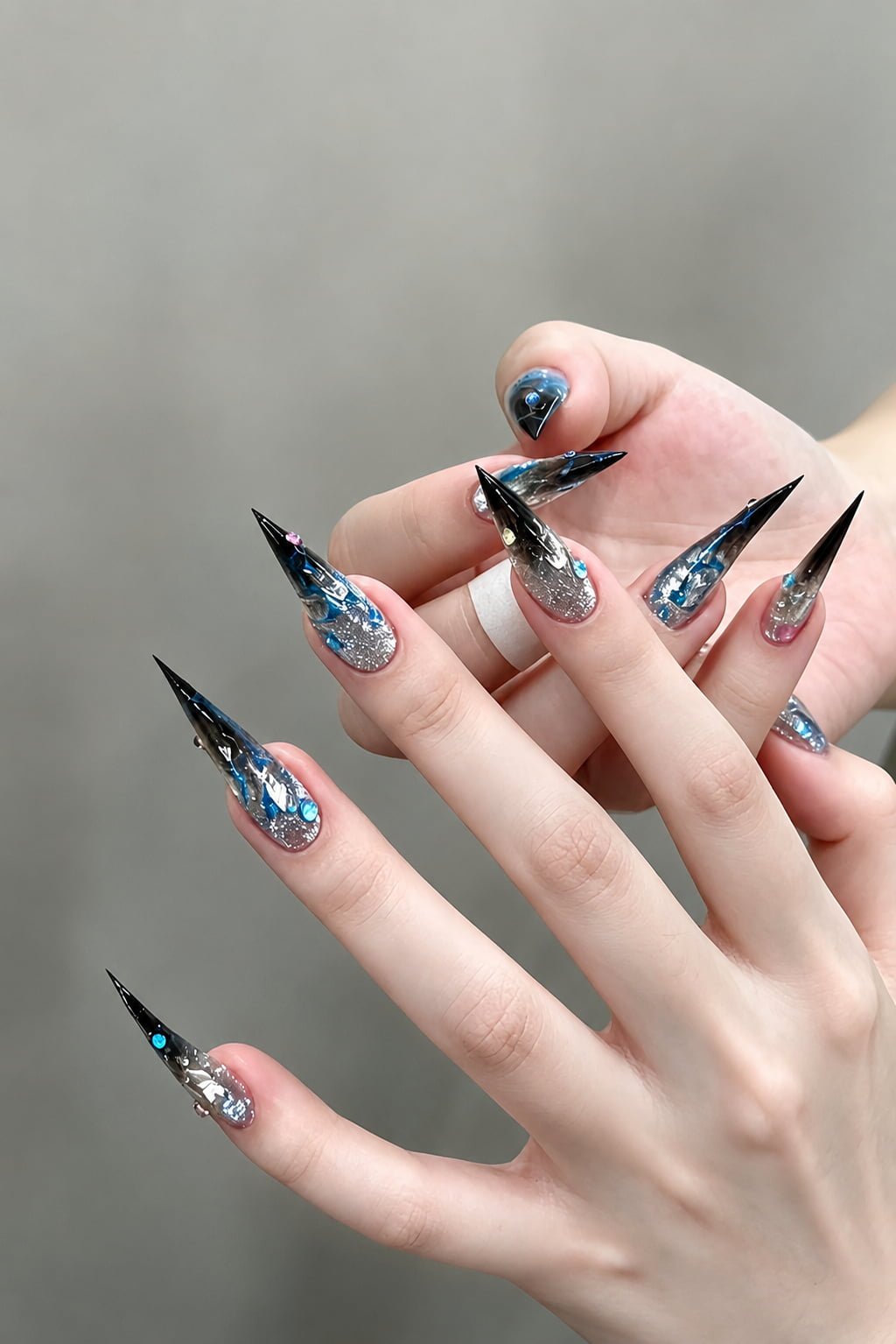 Black and Blue Chrome Cat Claw Nails with Rhinestone Accents