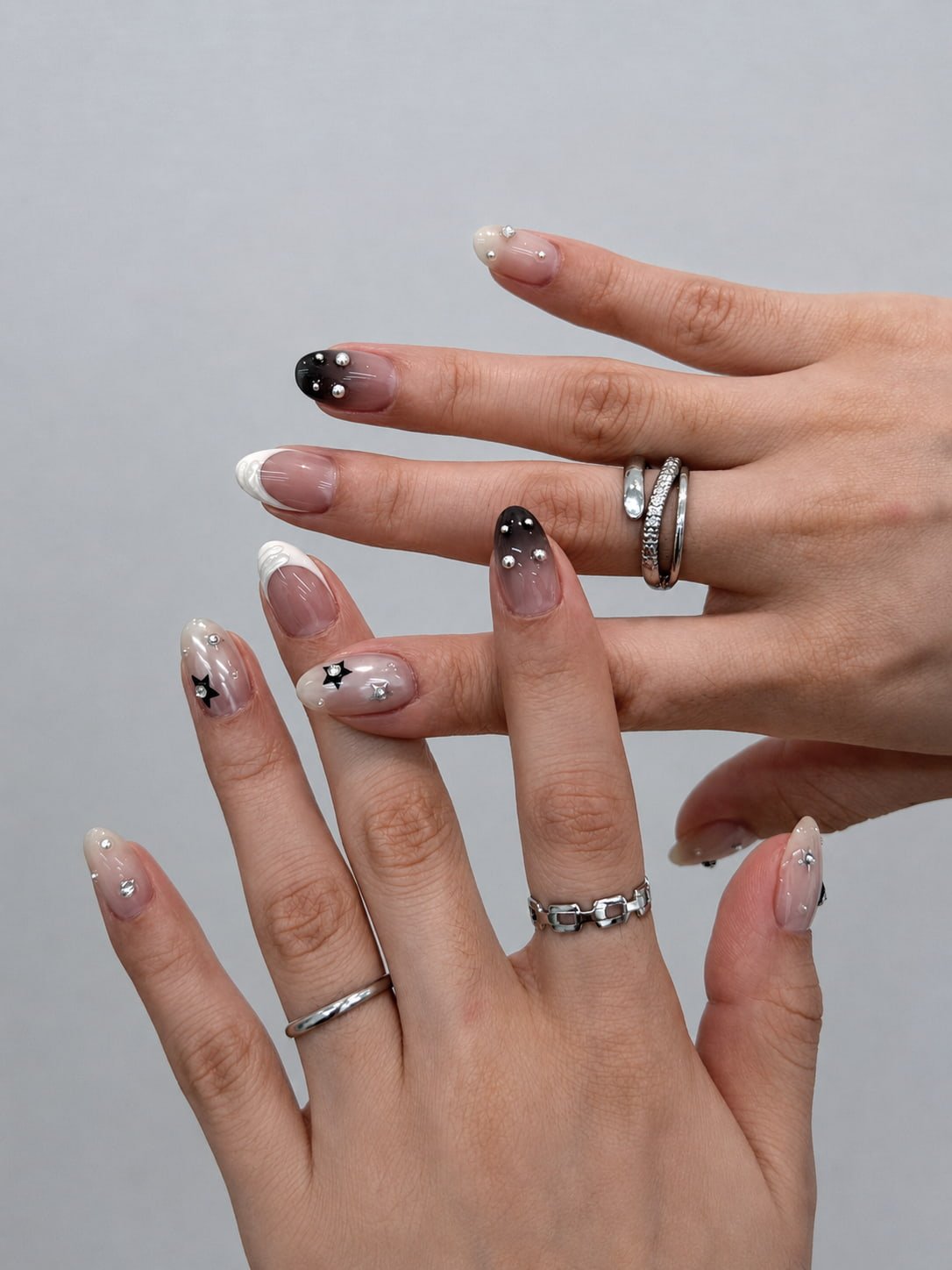 Black and White French Nails with Chrome Studs and Star Details