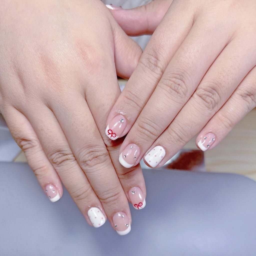 Black and White French Nails with Mixed Stripe and Polka Dot Tips