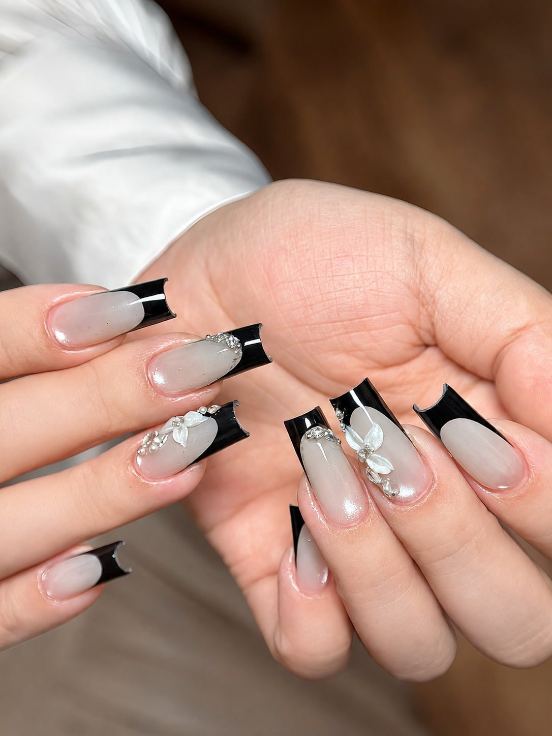 Black French Nails with Pearl Charms and 3D White Flowers