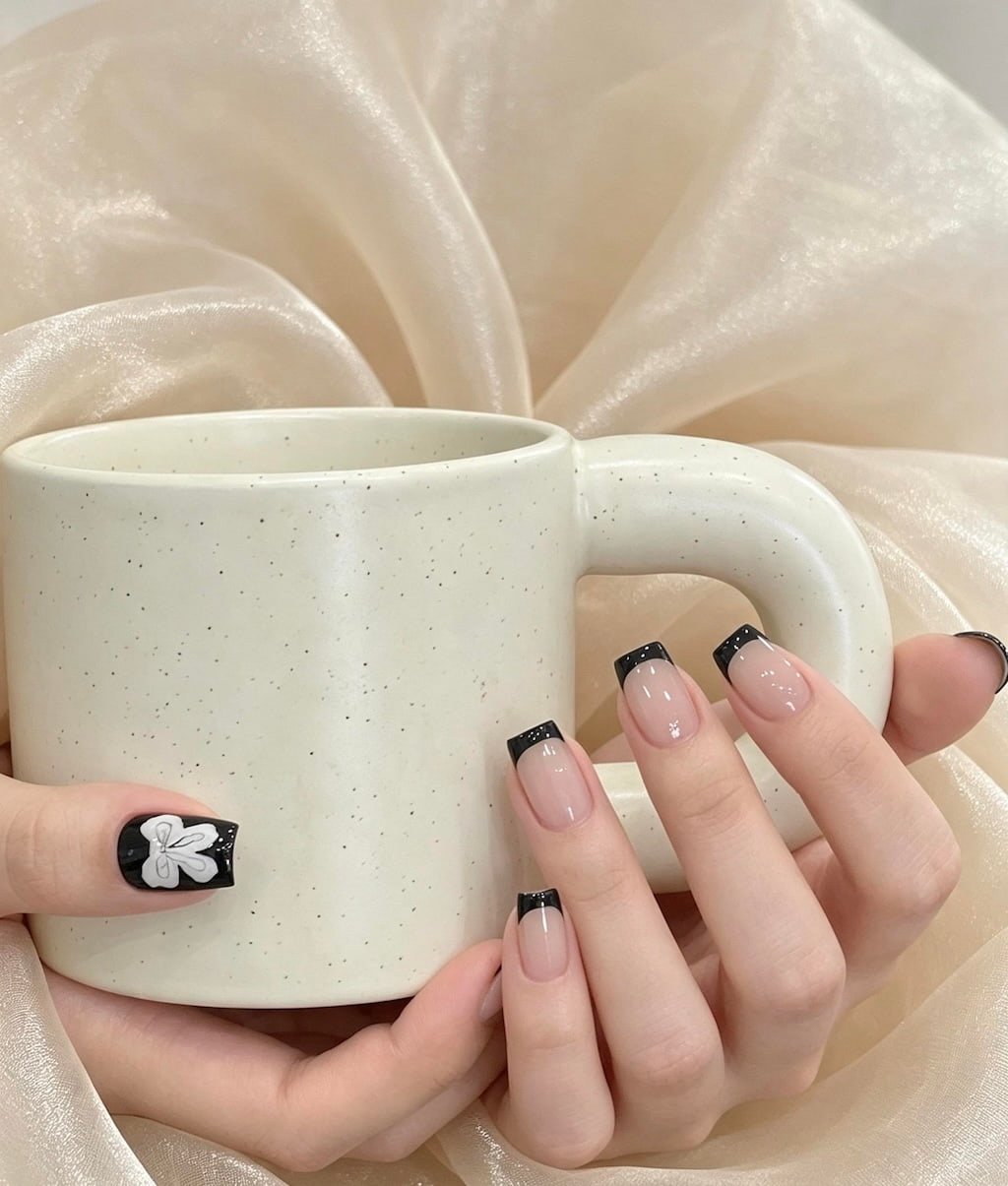 Black French Nails with White Flower Accent Art