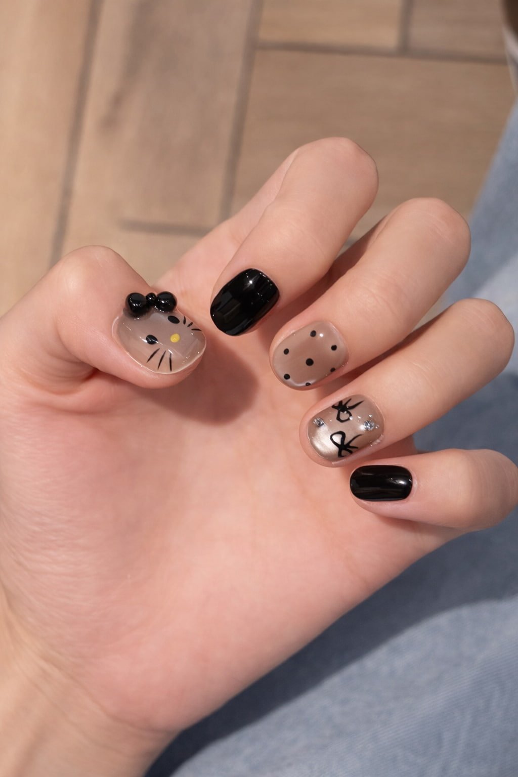 Black Polka Dot Hello Kitty Nail Art