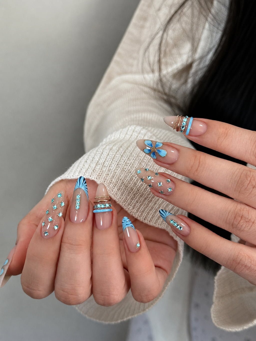Blue Butterfly Preppy Nails with Rhinestones and Gold Rings