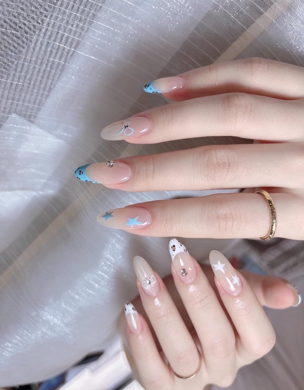 Blue French Nails with Star Art and Dainty Rhinestone Details