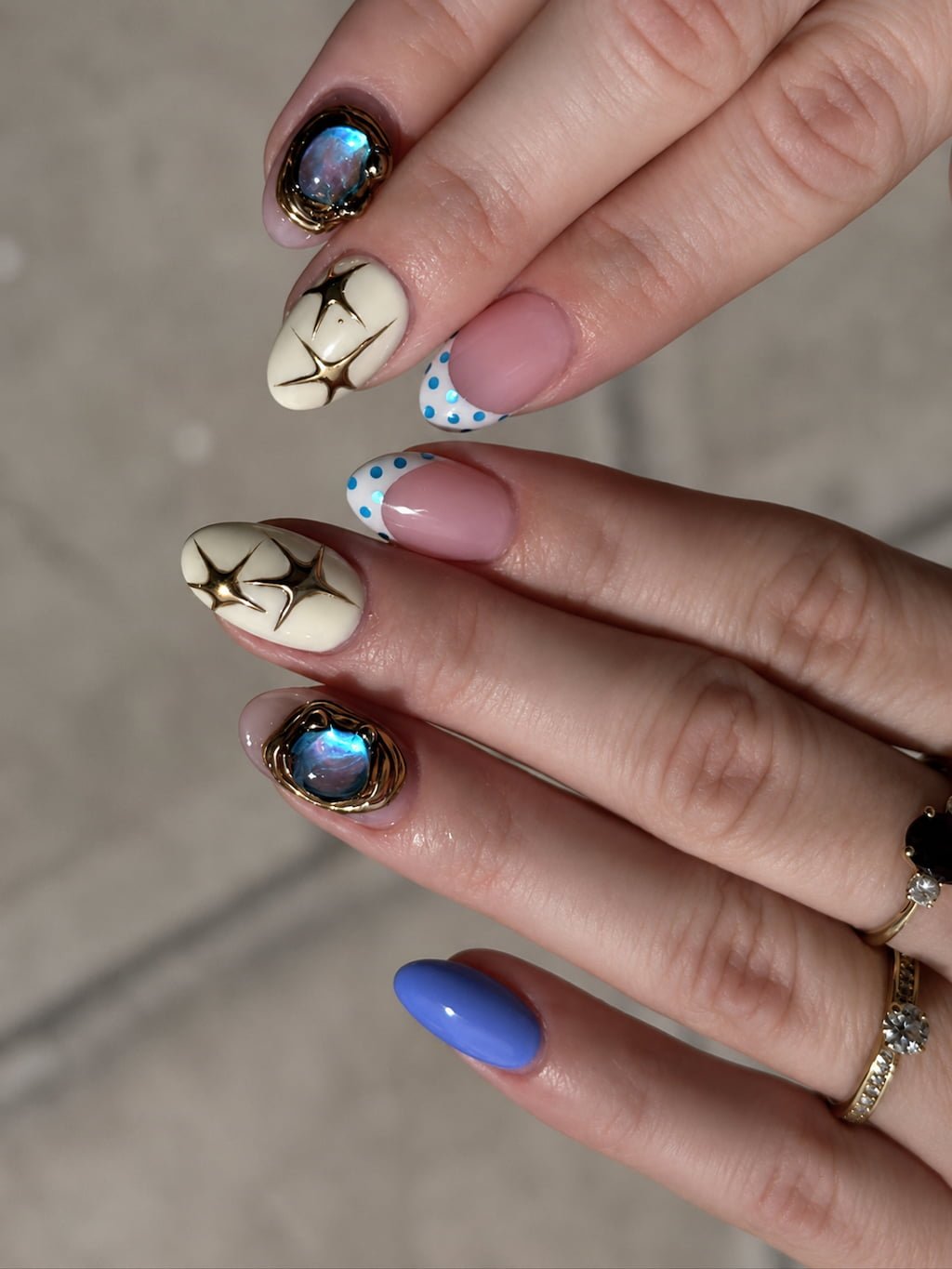Blue Opal Gems and Golden Starburst August Nails