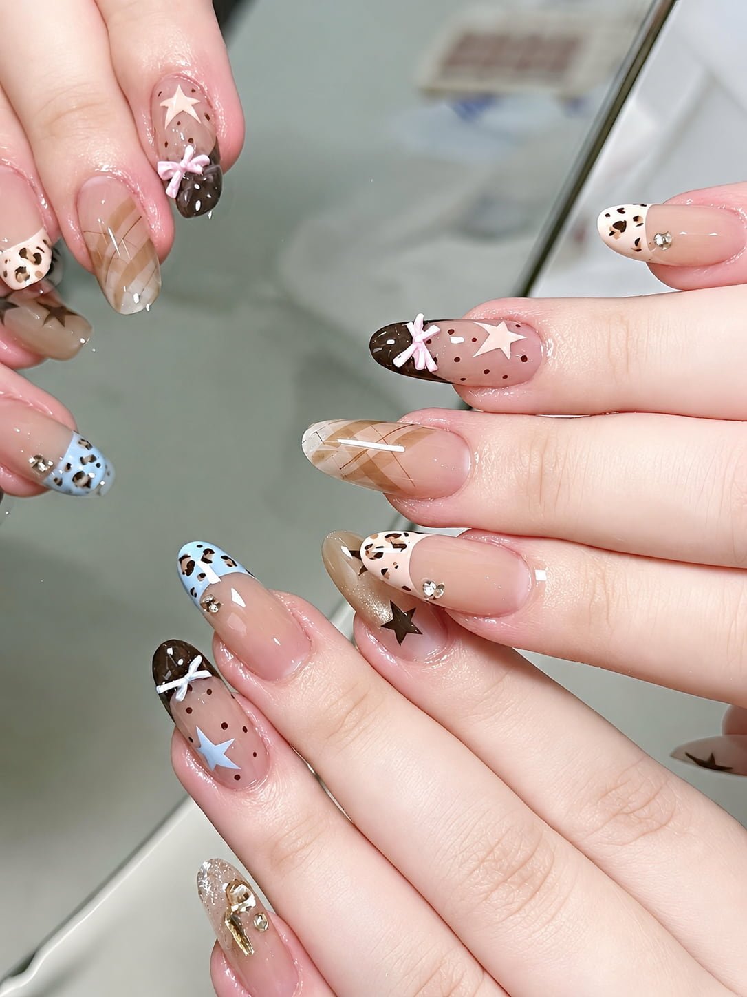 Brown and Blue French Nails with Star Art, Plaid, and Bow Details