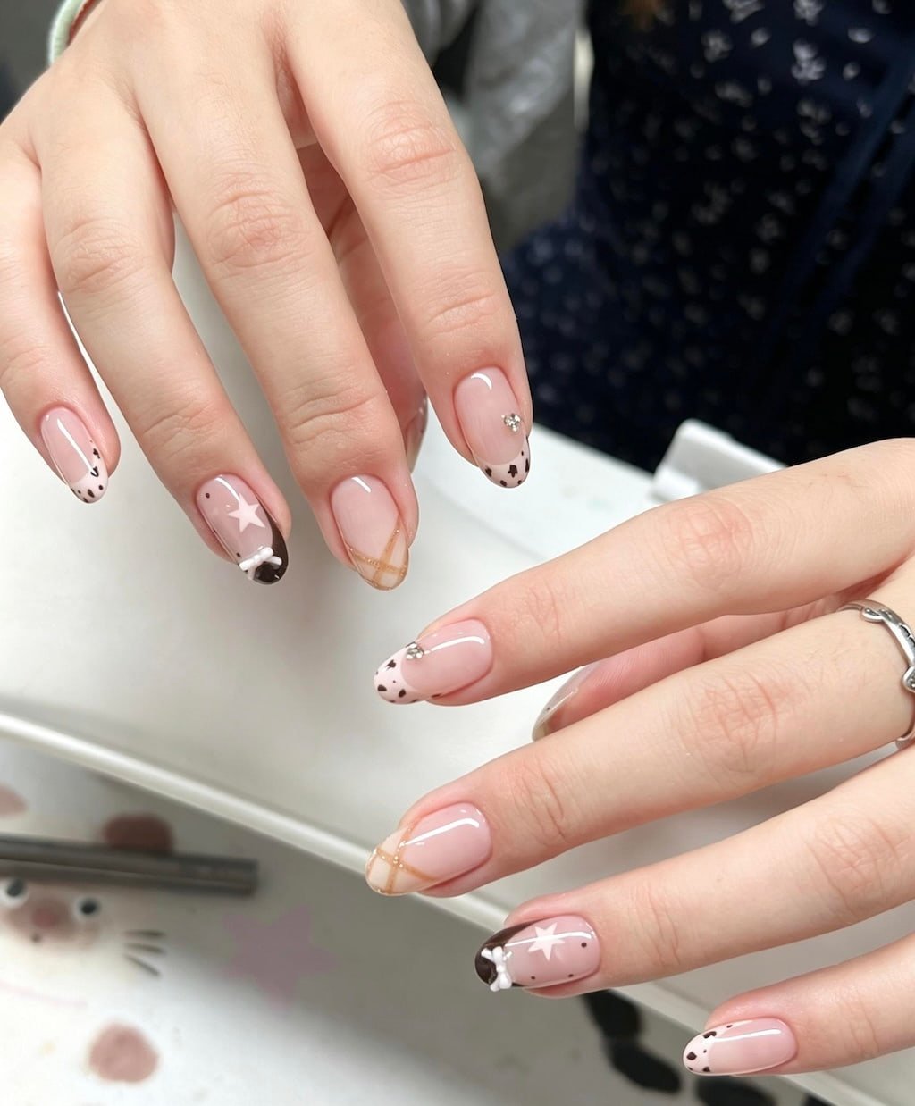 Brown French Nails with Star Art, Plaid Lines, and Animal Print Tips
