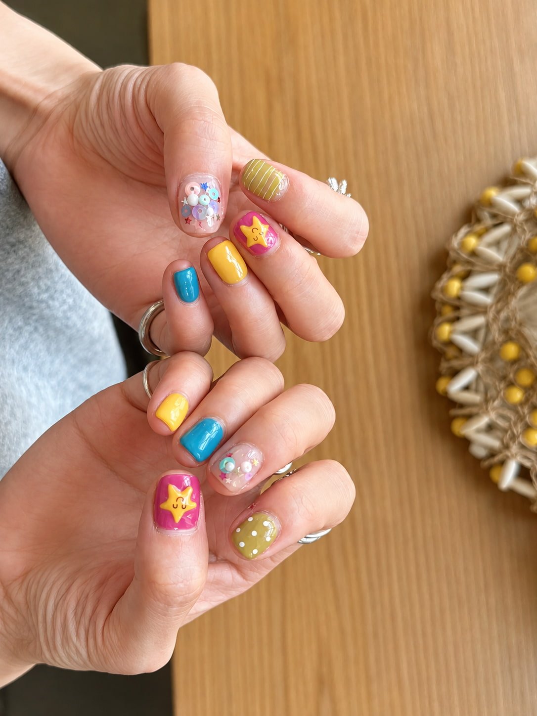 Colorful Cartoon Star Fall Nail Design with Playful Retro Vibes