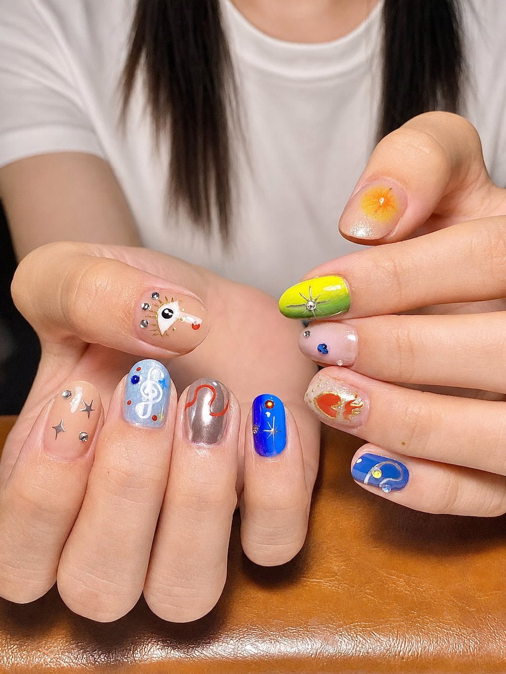 Colorful Cosmic Symbols and Star Art August Nails