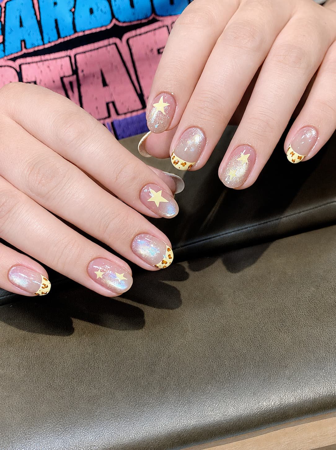 Glitter French Nails with Yellow Star Accents and Leopard Tips