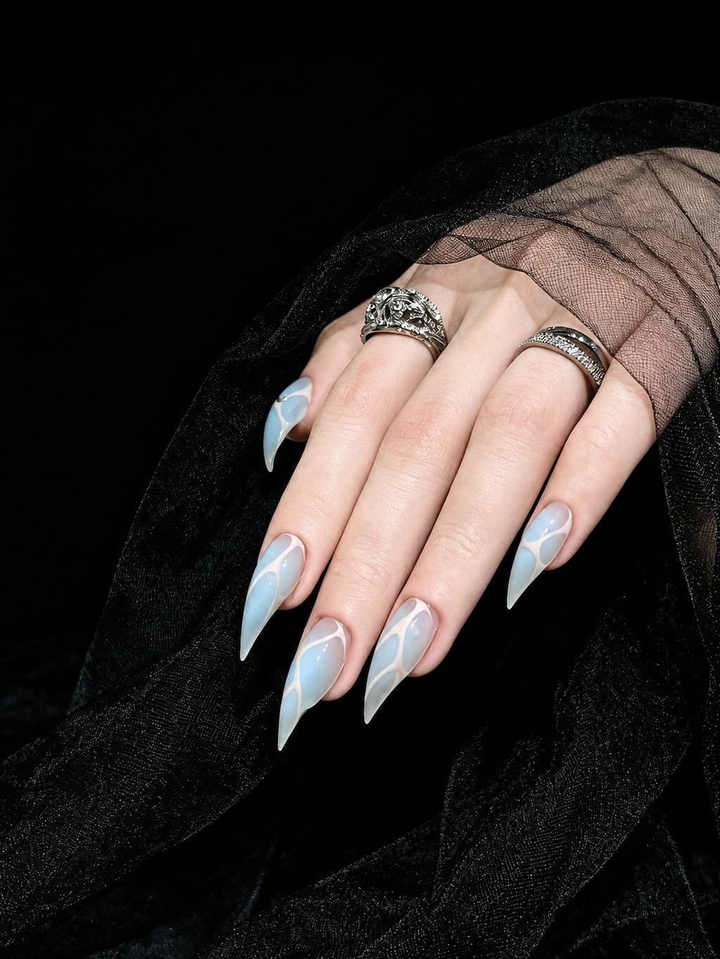 Icy Blue Cat Claw Nails with White Abstract Swirls