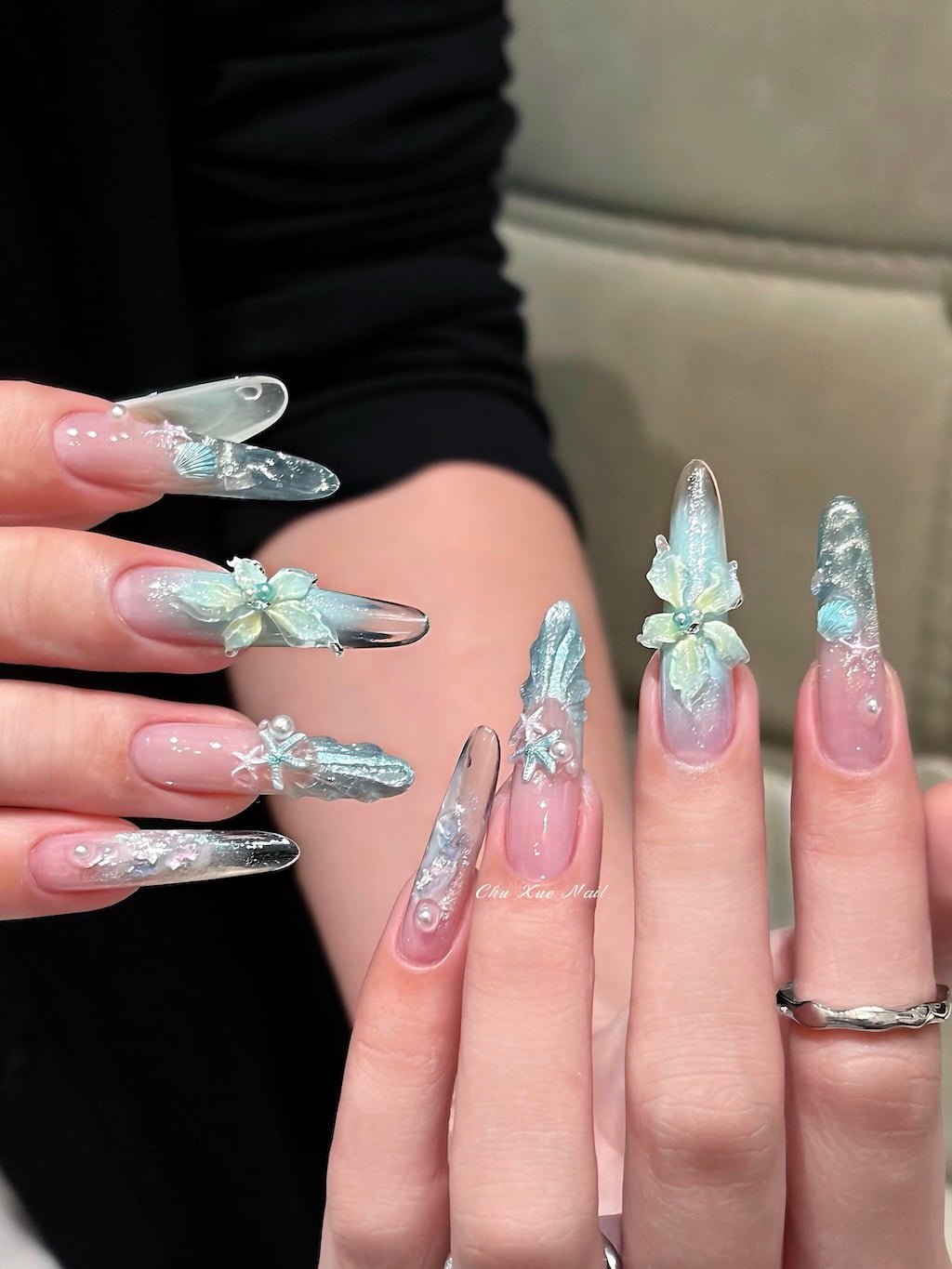 Icy Blue Summer Nail Art with 3D Bows and Shell Details
