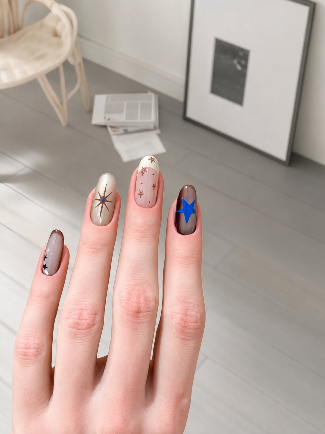 Minimalist Neutral Star Art Fall Nail Design with Blue Accent