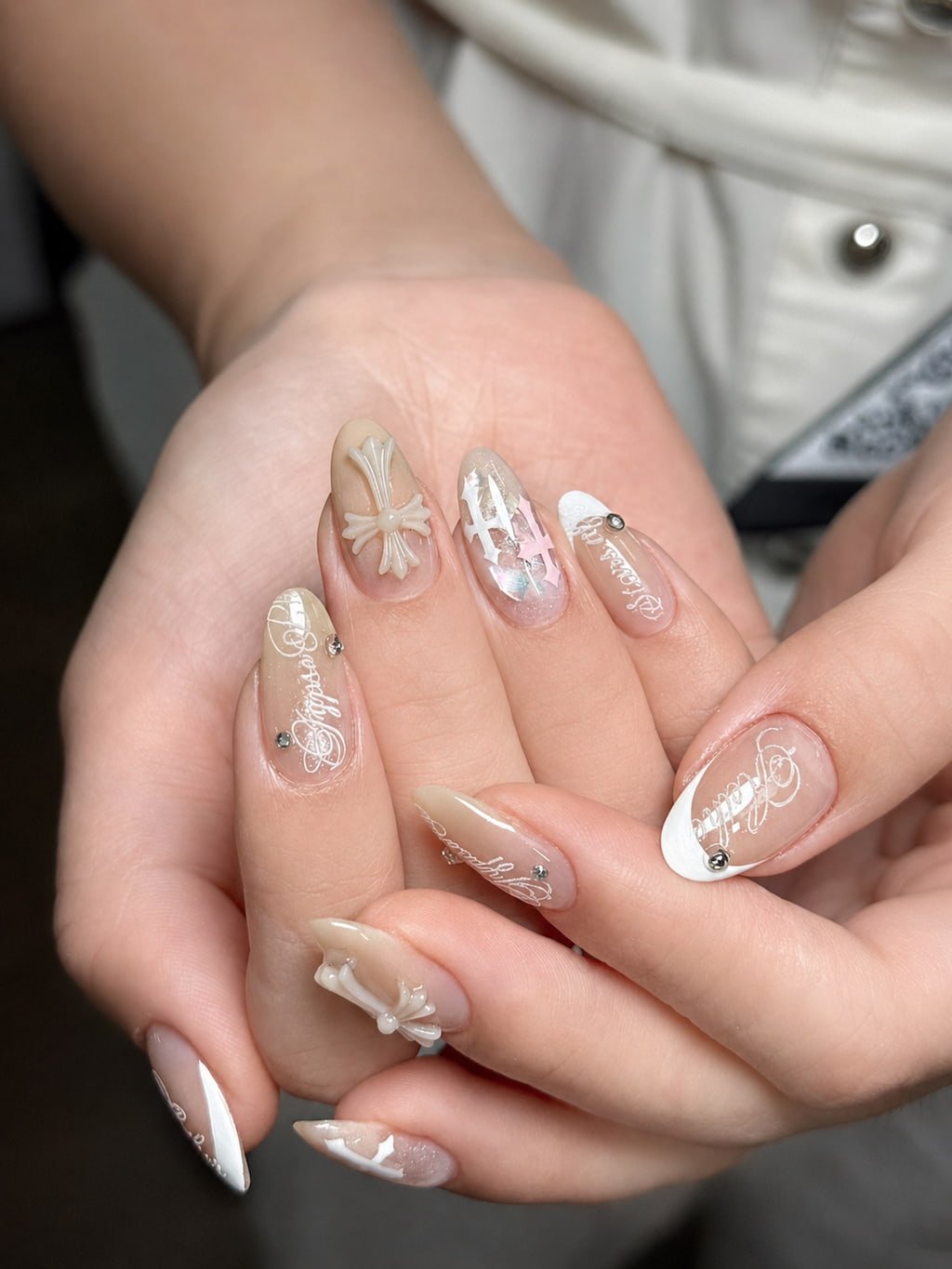 Neutral Summer Nail Design with 3D Cross Charms
