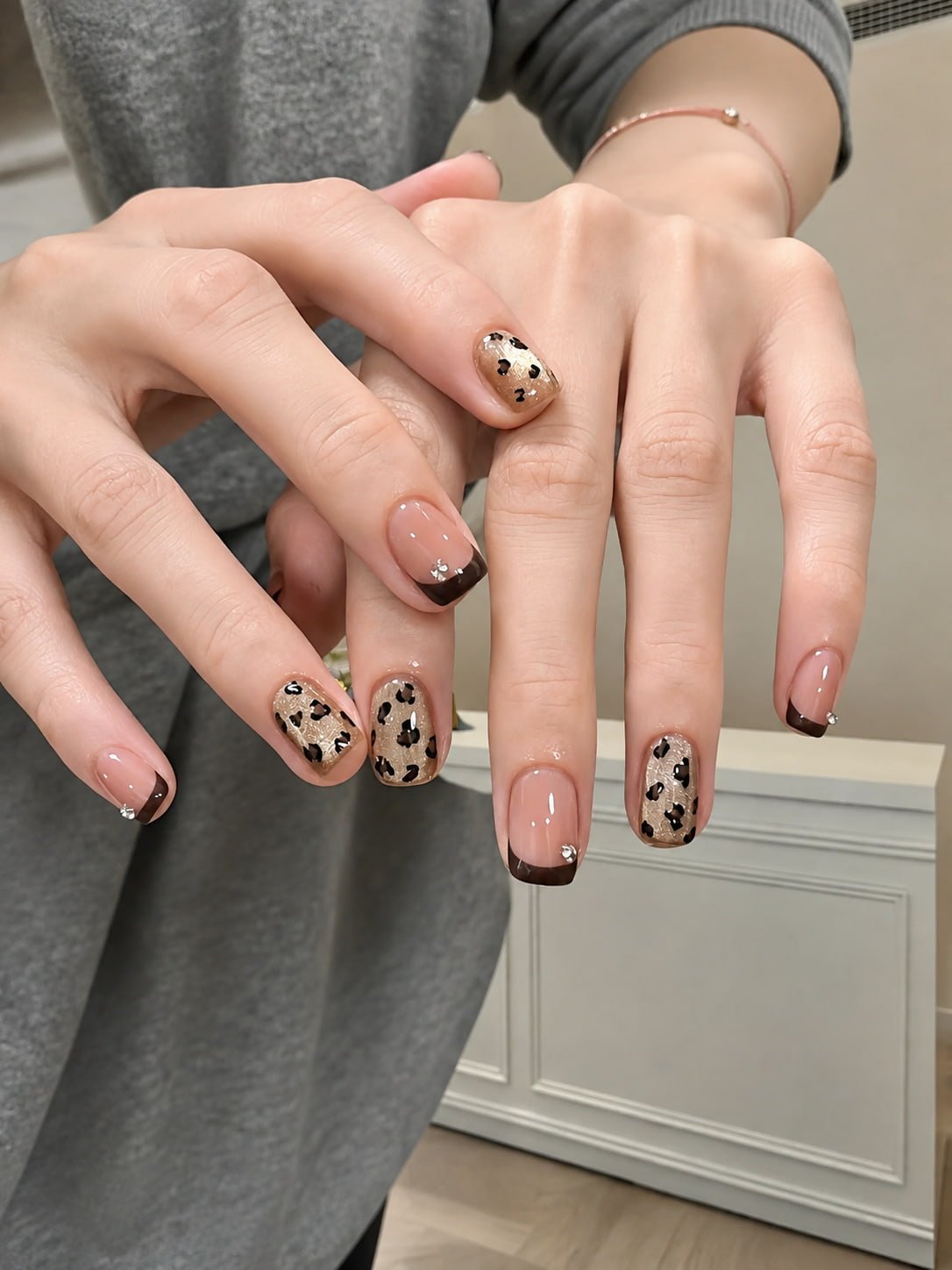 Nude French Tip Fall Nail Design with Leopard Print Accents