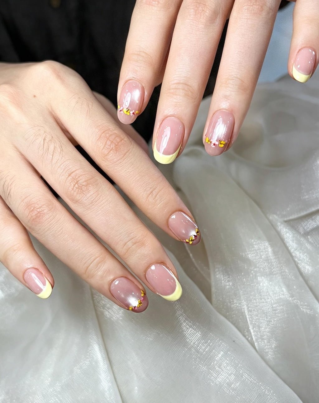 Pastel Yellow French Nails with Tiny Floral Accents