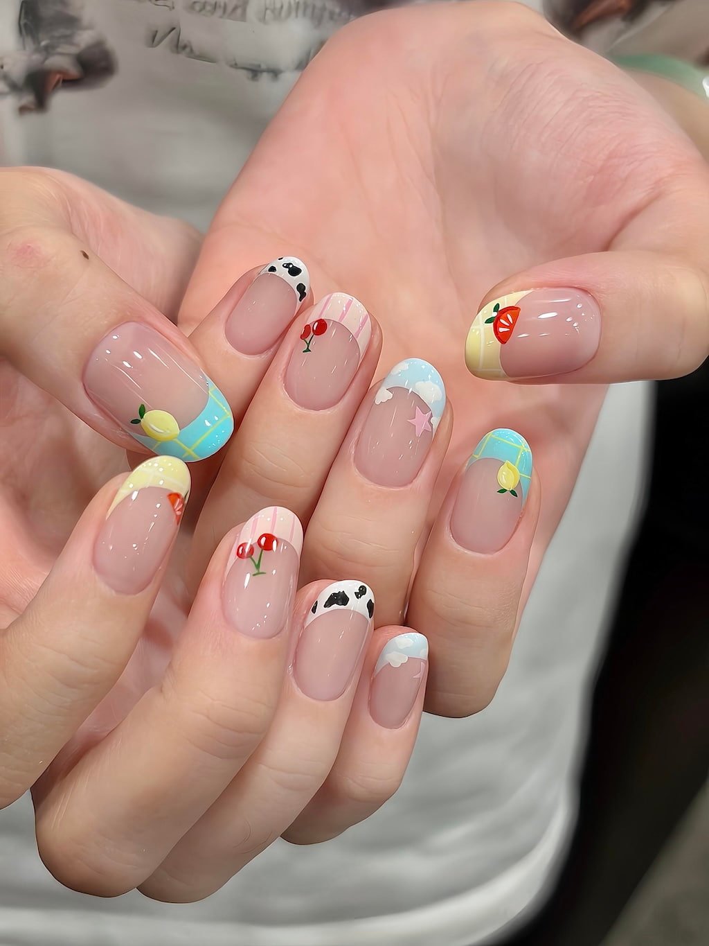 Playful Preppy Nails with Cherry, Lemon, and Cow Print Tips