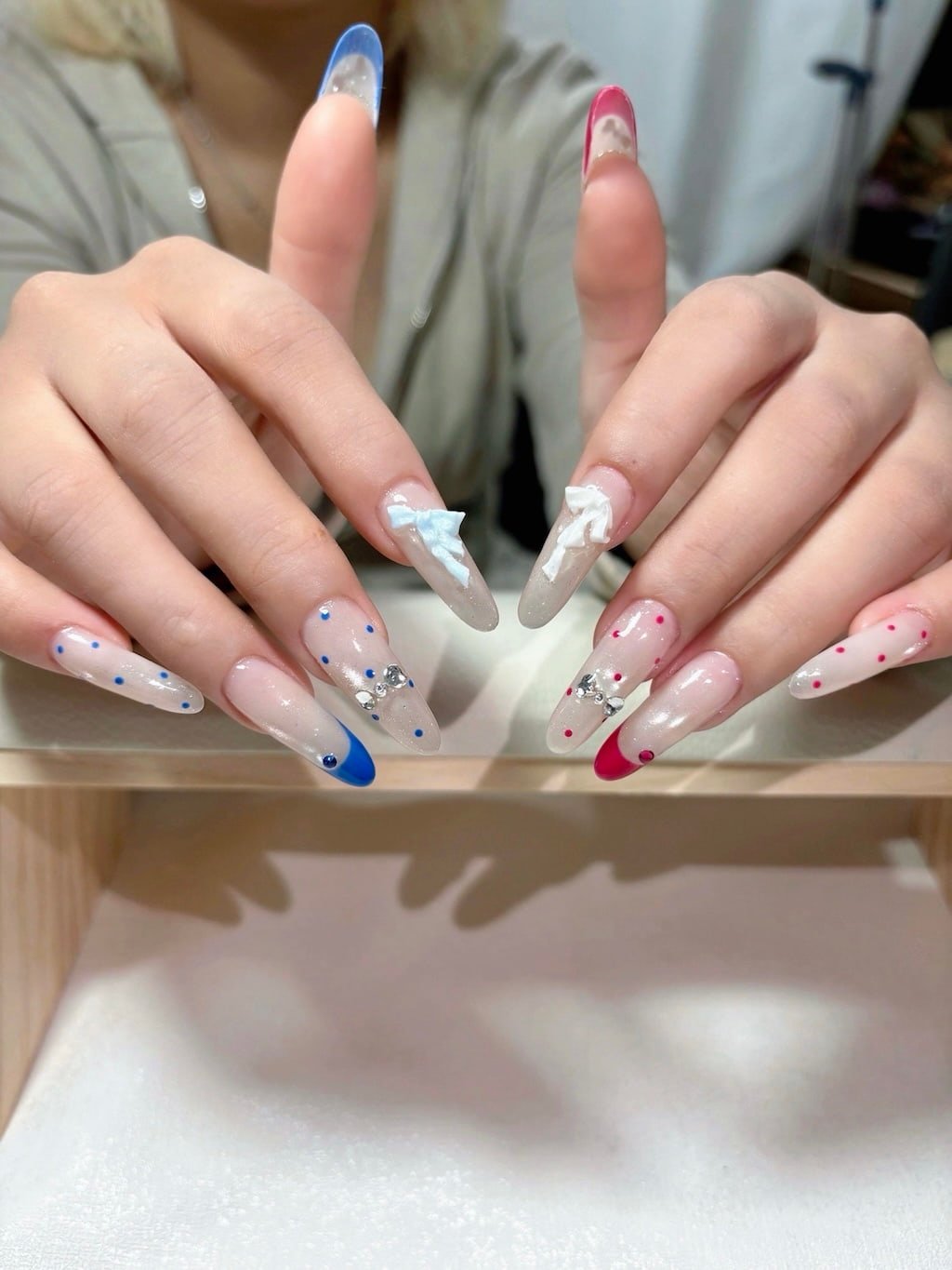 Red and Blue French Nails with Polka Dots, Rhinestones, and 3D Bows