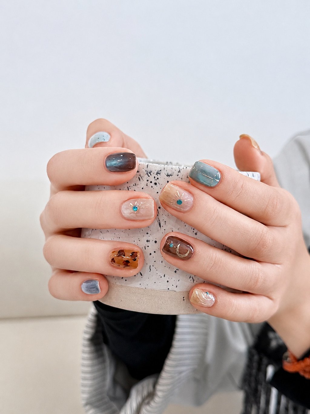 Soft Blue and Cocoa Mix Fall Nail Design with Delicate Gem Accents