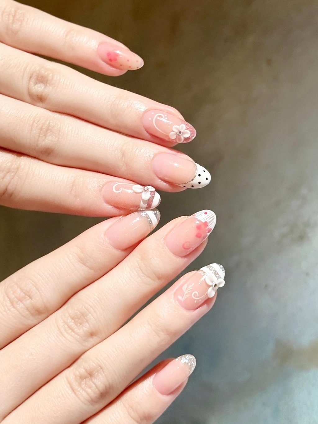 Soft Pink French Nails with Bows, Flowers, and Silver Glitter Tips