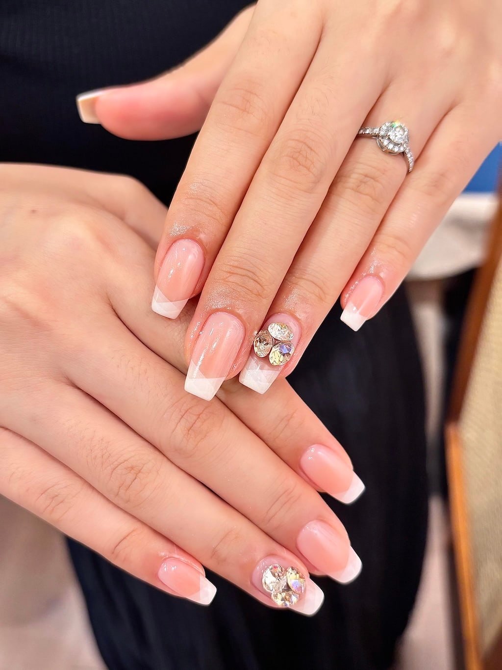 Soft Pink French Nails with Geometric White Tips and Crystal Charms