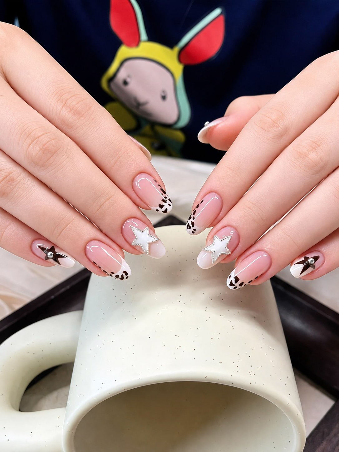 Star French Nails with Cow Print Tips and Rhinestone Accents