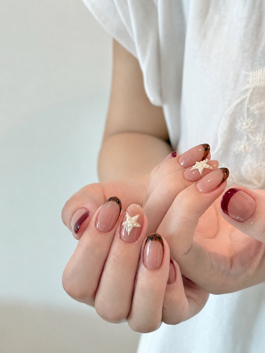 Sweet French Nails with Brown Bows and White Drip Details