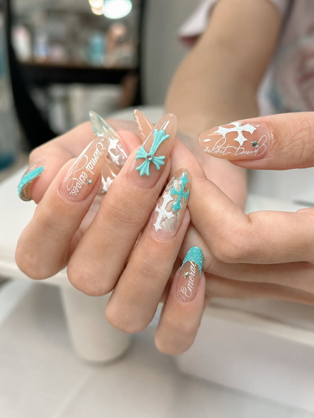 Turquoise Bow and White Cross Y2K Nails