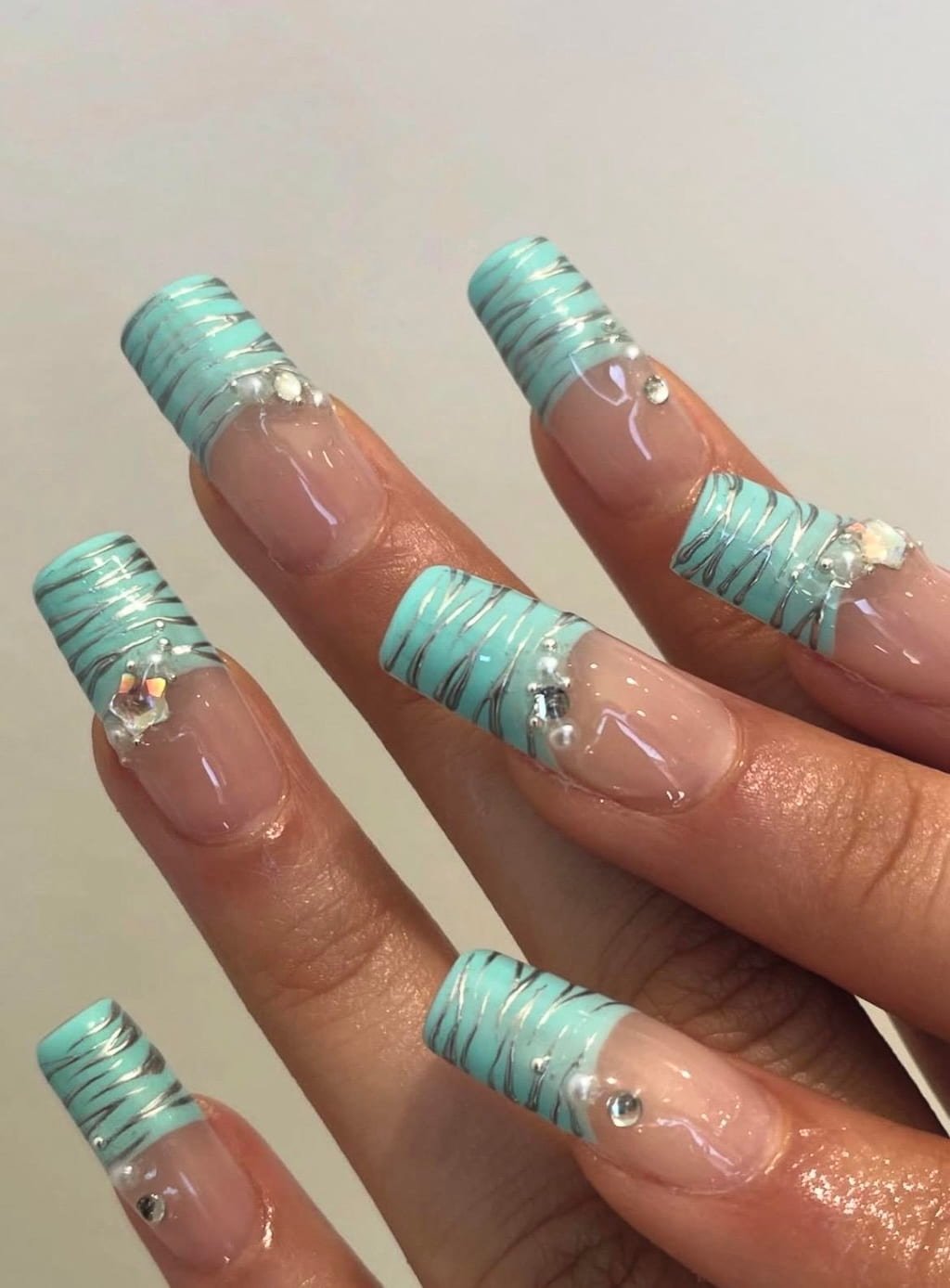 Turquoise French Tip Summer Nail Design with Silver Details