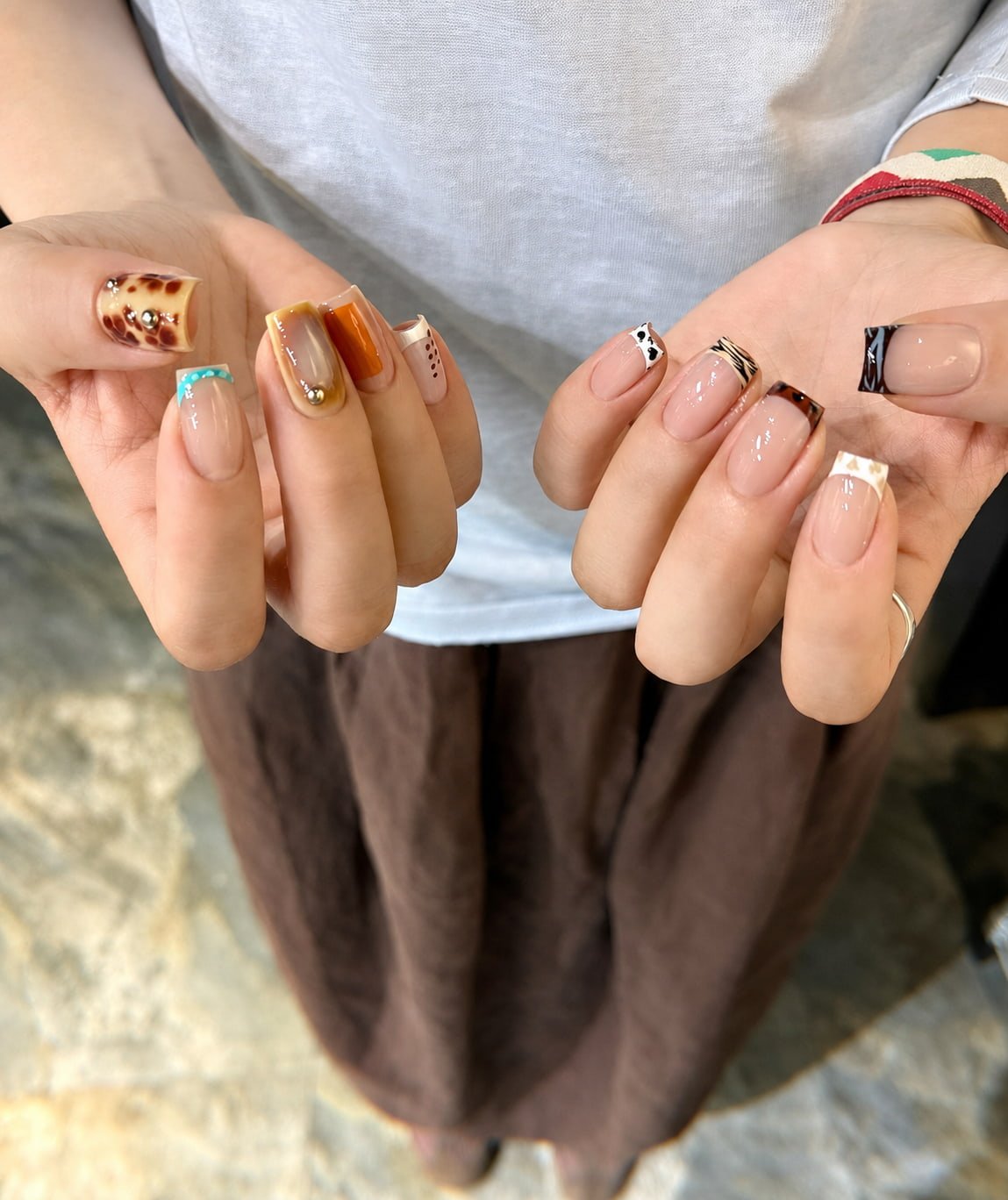 White French Nails with Gold Chain and Rhinestone Accents